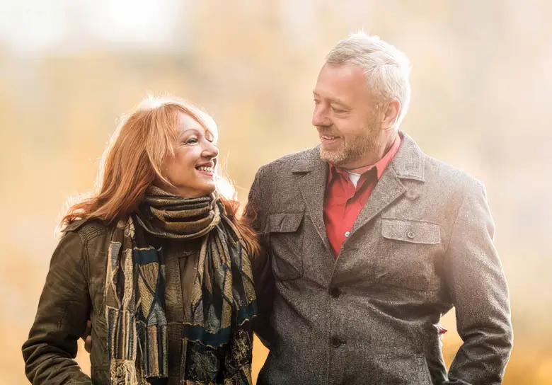 A senior couple out on a brisk walk